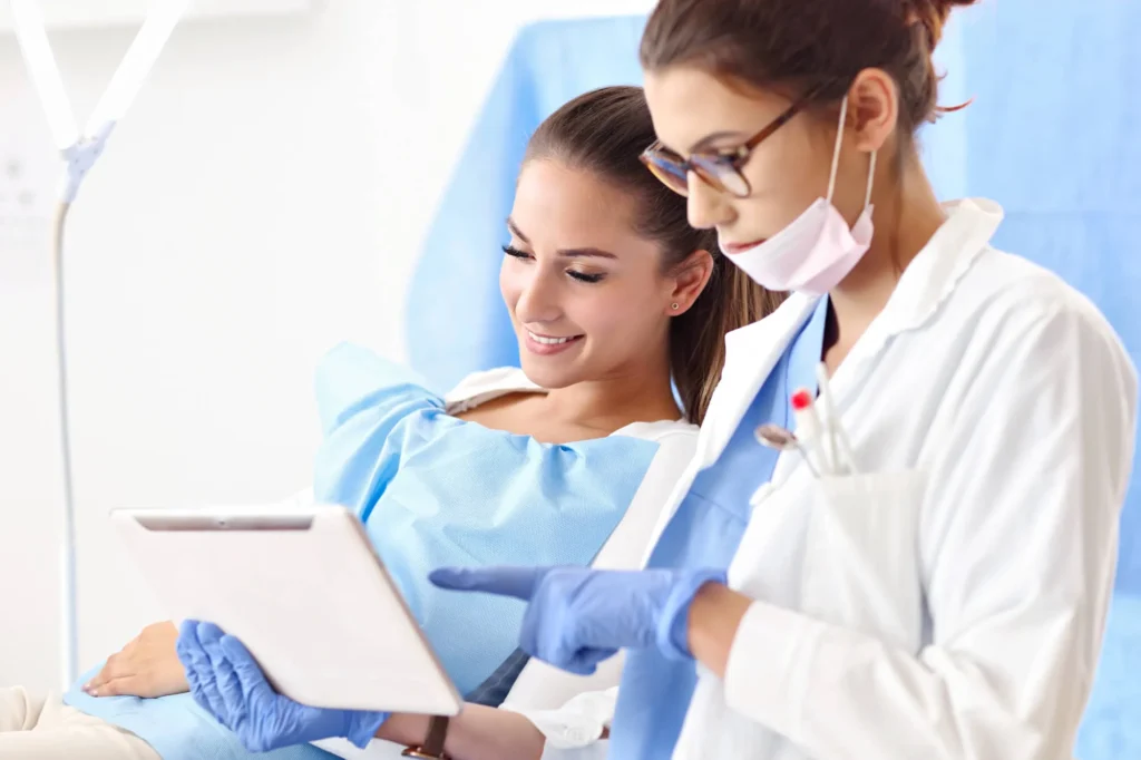 dentist explaining how a root canal charlotte works