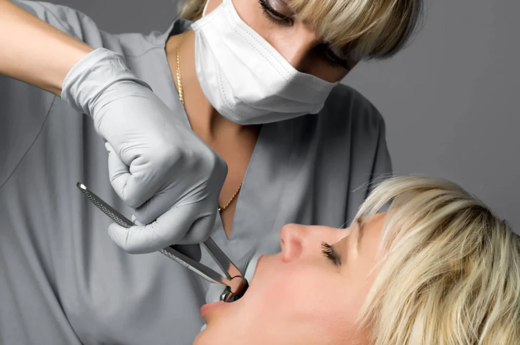 Dentist South Charlotte performs tooth extraction