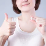 patient doing the thumbs up sign after visiting a Dentist South Charlotte