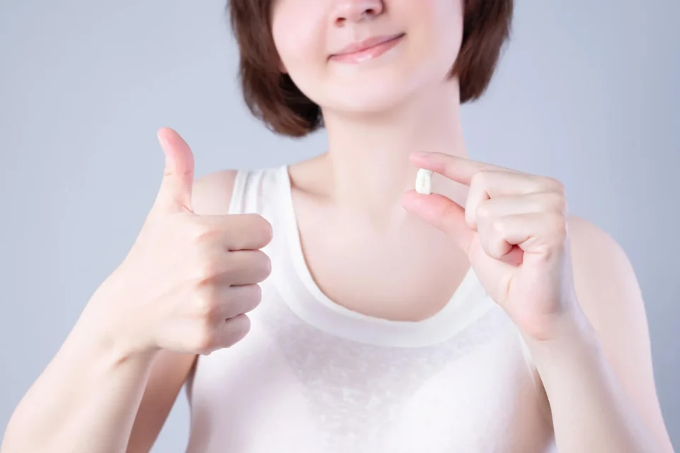 patient doing the thumbs up sign after visiting a Dentist South Charlotte