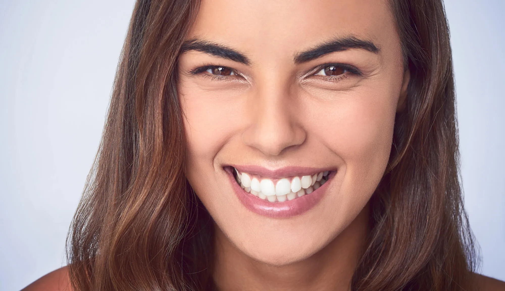 patient smiling after ballantyne cosmetic dentistry